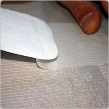 Keep easing off the backing paper till the patch is completely stuck down, make sure there are no air bubbles.